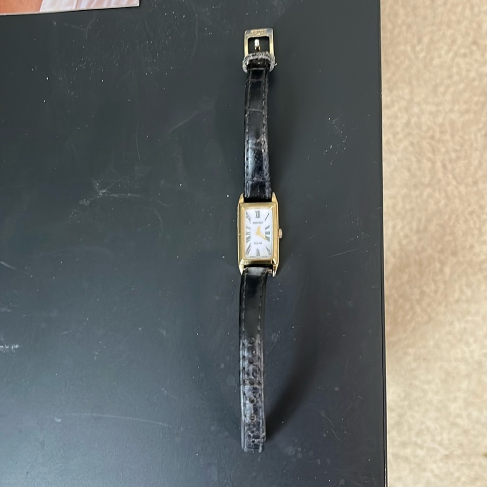 Seiko solar watch with black leather wrist band. As is.